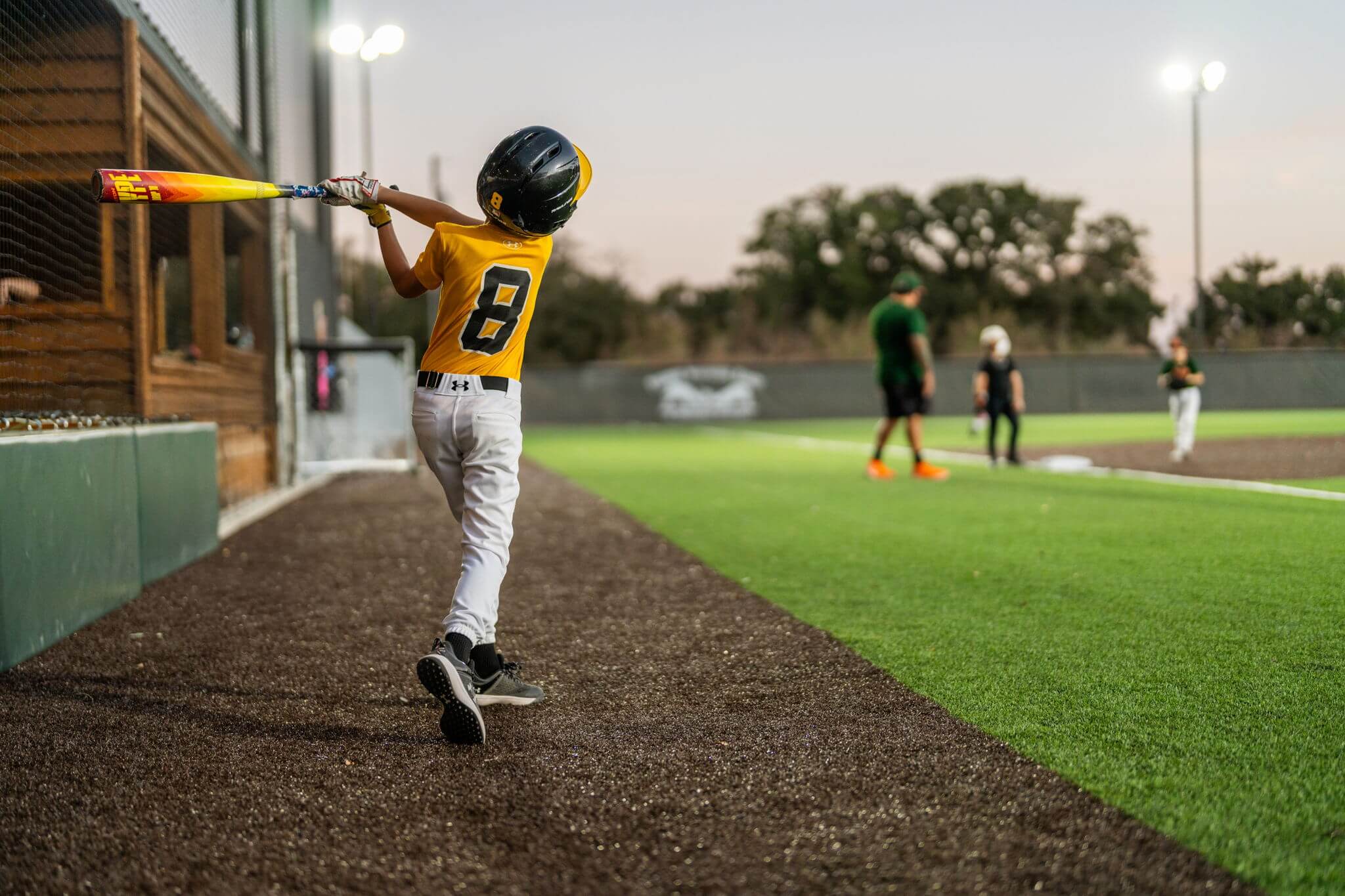 Youth baseball player batting during game